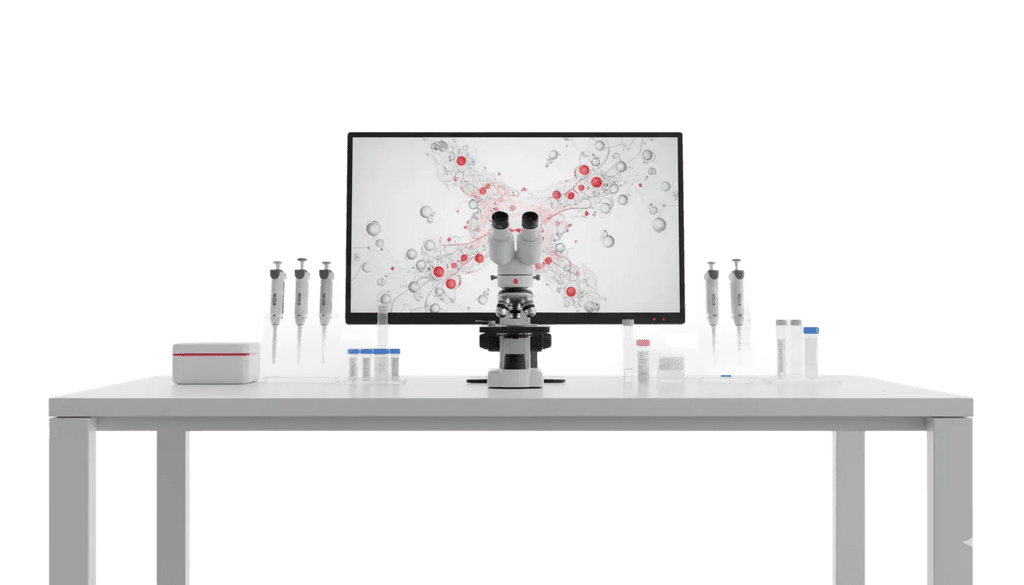 Laboratory bench with a microscope and stem cell imaging on screen